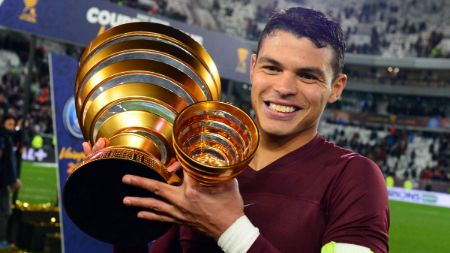 Thiago Silva poses a trophy after winning it.